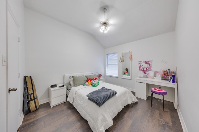 bedroom featuring a ceiling fan, baseboards, dark wood-style floors, and lofted ceiling