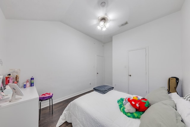 bedroom with visible vents, baseboards, a ceiling fan, dark wood-style floors, and lofted ceiling