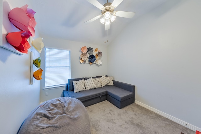 carpeted living room with baseboards, a ceiling fan, and vaulted ceiling