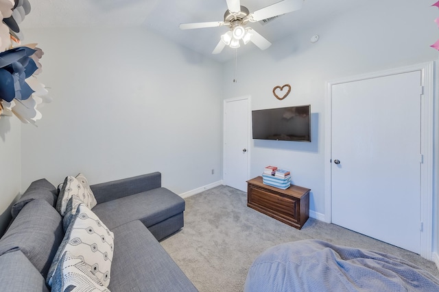 living area with ceiling fan, visible vents, carpet floors, lofted ceiling, and baseboards