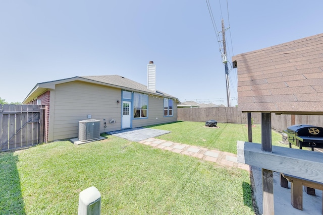 view of yard with a fenced backyard and cooling unit