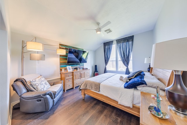 bedroom with visible vents, ceiling fan, vaulted ceiling, and wood finished floors