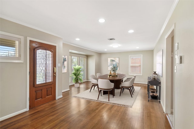 5307 Carew St, Houston, TX 77096 - dining area featuring baseboards, wood finished floors, crown molding, and recessed lighting