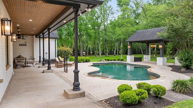 pool with a yard, a gazebo, and a patio area