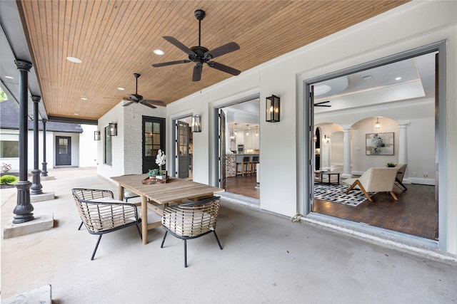 view of patio featuring outdoor dining space and ceiling fan