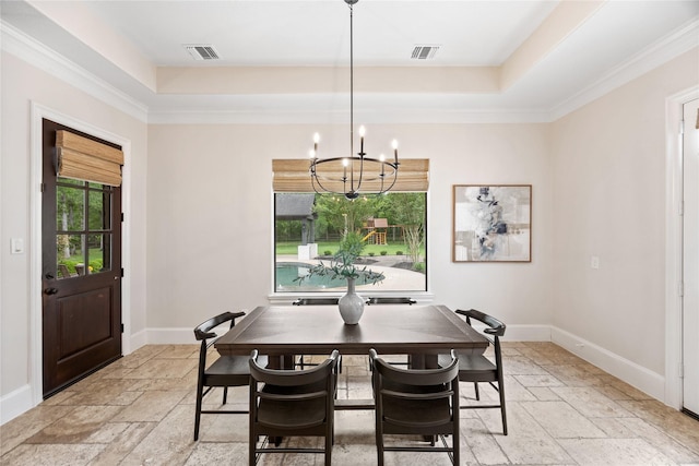 dining space with visible vents, stone tile floors, a raised ceiling, and a chandelier