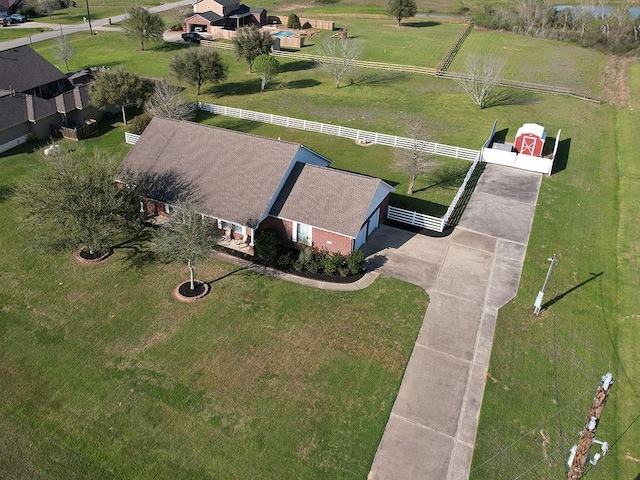 birds eye view of property featuring a rural view