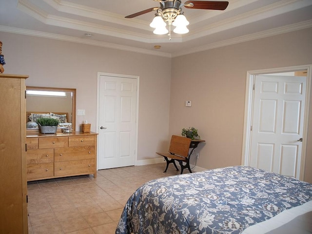 bedroom with baseboards, ornamental molding, light tile patterned floors, and a tray ceiling