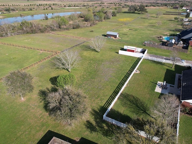 drone / aerial view with a water view and a rural view
