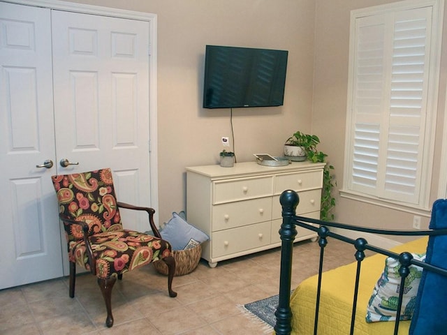 bedroom featuring light tile patterned floors