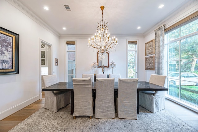 3028 Locke Ln, Houston, TX 77019 - dining space featuring a chandelier, crown molding, plenty of natural light, wood finished floors, and recessed lighting