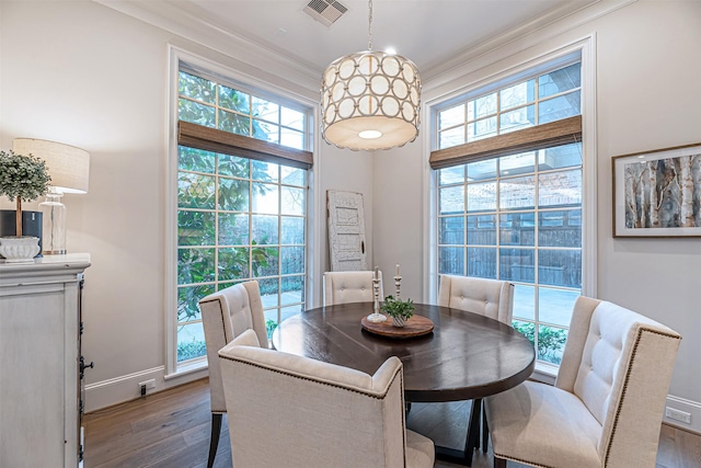 3028 Locke Ln, Houston, TX 77019 - dining room with wood finished floors, healthy amount of natural light, ornamental molding, and baseboards