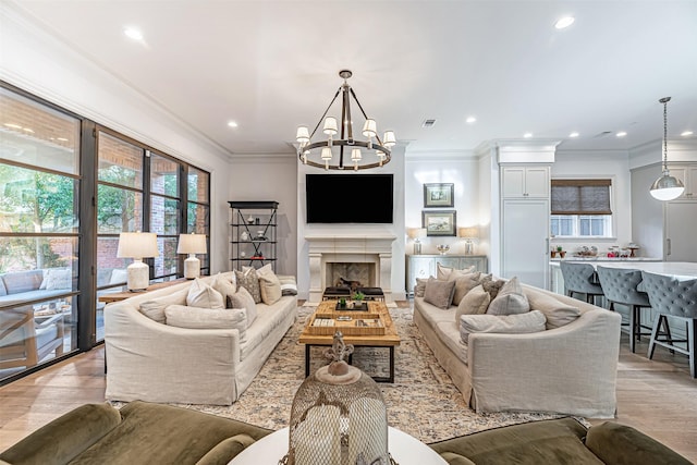 3028 Locke Ln, Houston, TX 77019 - living area featuring plenty of natural light, a chandelier, recessed lighting, light wood-style floors, and ornamental molding