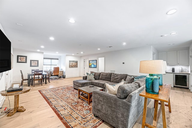 3028 Locke Ln, Houston, TX 77019 - living area with light wood-style flooring, recessed lighting, and beverage cooler