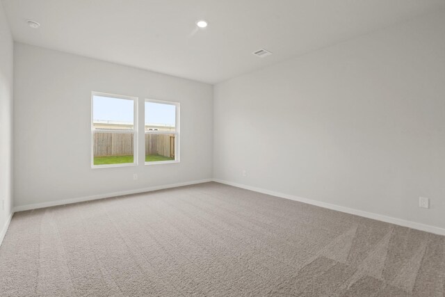 17824 Lionheart Rd, Conroe, TX 77306 - unfurnished room with carpet flooring, recessed lighting, baseboards, and visible vents