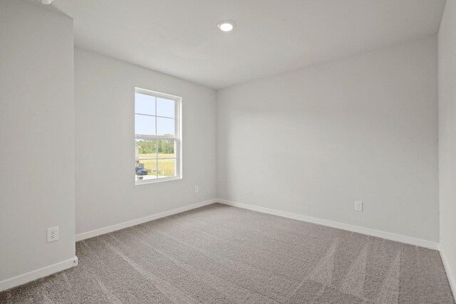 17824 Lionheart Rd, Conroe, TX 77306 - carpeted empty room with baseboards and recessed lighting