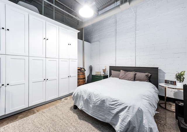 bedroom with concrete flooring