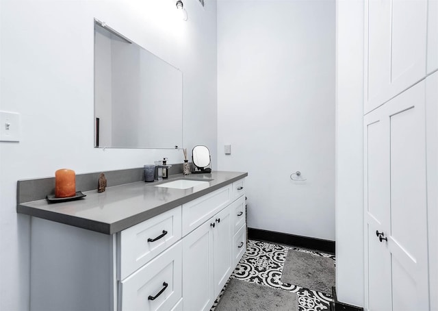 bathroom with baseboards and vanity