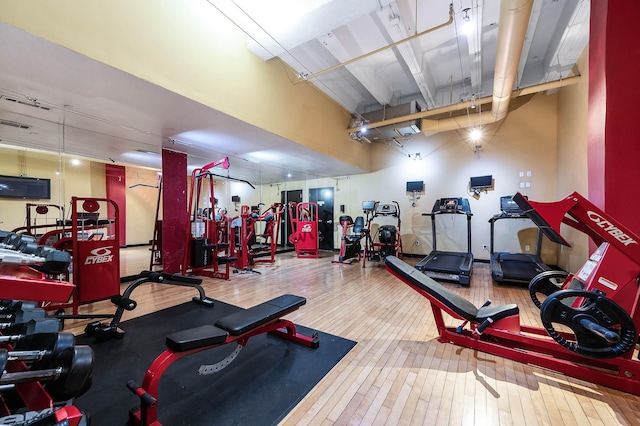 workout area featuring hardwood / wood-style floors