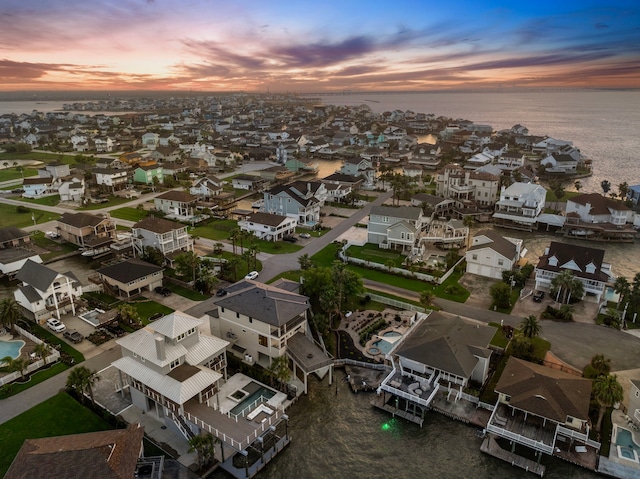 1303 Oahu Dr, Tiki Island, TX 77554 - aerial view of property's location with a large body of water and nearby suburban area