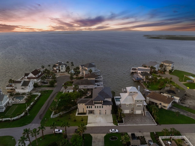 1303 Oahu Dr, Tiki Island, TX 77554 - aerial view of property's location with a nearby body of water and nearby suburban area