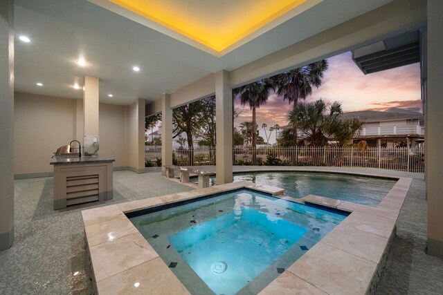 1303 Oahu Dr, Tiki Island, TX 77554 - view of pool featuring fence, a patio, and a pool with connected hot tub