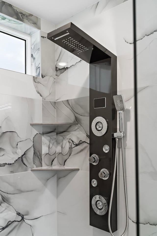 1303 Oahu Dr, Tiki Island, TX 77554 - bathroom view of a marble finish shower