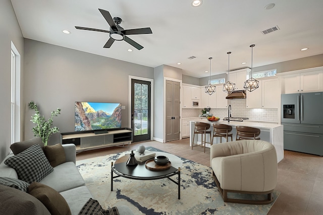 1420 Weiss St, Houston, TX 77009 - living room featuring a ceiling fan and recessed lighting