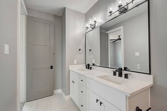 1420 Weiss St, Houston, TX 77009 - bathroom with marble finish flooring, a ceiling fan, double vanity, and baseboards