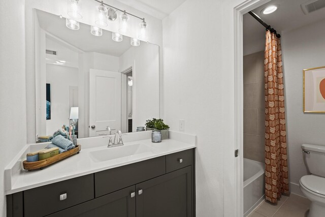 500 Dove Meadow Ln, Katy, TX 77493 - full bath featuring toilet, vanity, shower / tub combo, and tile patterned flooring