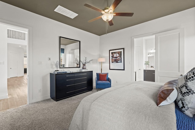 500 Dove Meadow Ln, Katy, TX 77493 - carpeted bedroom featuring baseboards, ensuite bath, and a ceiling fan