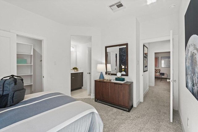 500 Dove Meadow Ln, Katy, TX 77493 - bedroom with light carpet, baseboards, and ensuite bathroom