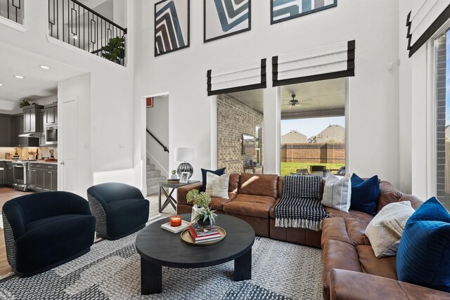 500 Dove Meadow Ln, Katy, TX 77493 - living area featuring a towering ceiling, stairway, and ceiling fan
