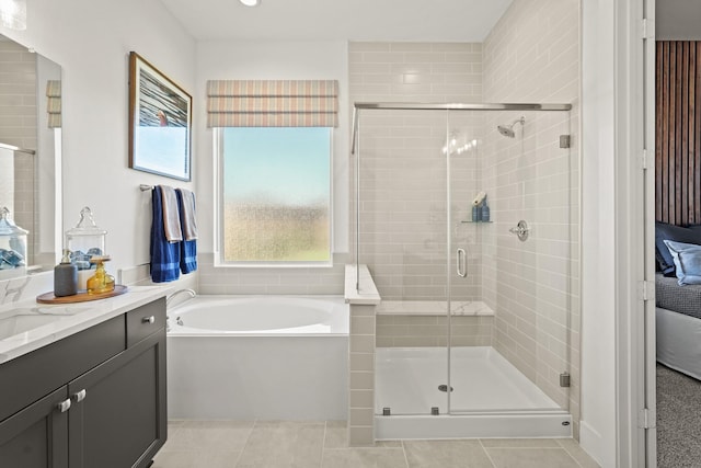 500 Dove Meadow Ln, Katy, TX 77493 - bathroom with vanity, a garden tub, a stall shower, tile patterned flooring, and recessed lighting