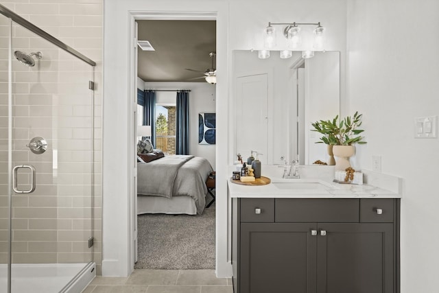 500 Dove Meadow Ln, Katy, TX 77493 - ensuite bathroom with a shower stall, vanity, a ceiling fan, and tile patterned flooring