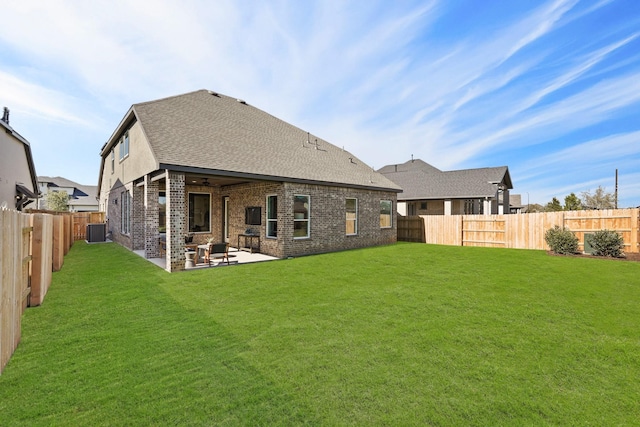 500 Dove Meadow Ln, Katy, TX 77493 - back of house featuring a patio area, central AC, brick siding, a shingled roof, and ceiling fan
