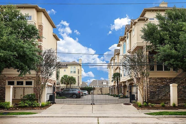 5768 Sugar Hill Dr, Houston, TX 77057 - view of road with a residential view and a gate