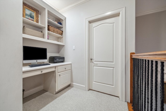 5768 Sugar Hill Dr, Houston, TX 77057 - office area with built in desk, baseboards, light colored carpet, and crown molding