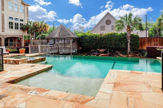 5768 Sugar Hill Dr, Houston, TX 77057 - view of swimming pool with a gazebo, a fenced backyard, a pool with connected hot tub, and a patio area
