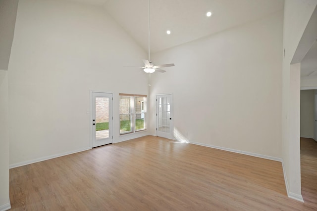 13510 Cedar Point Dr, Cypress, TX 77429 - unfurnished living room featuring baseboards, recessed lighting, light wood-style floors, a ceiling fan, and high vaulted ceiling