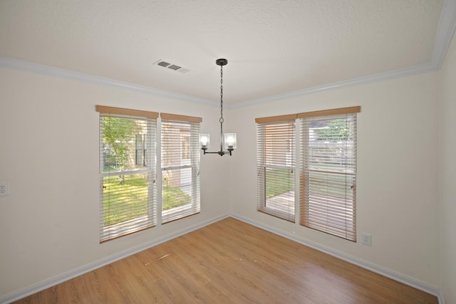 13510 Cedar Point Dr, Cypress, TX 77429 - unfurnished dining area with crown molding, visible vents, and light wood-style flooring