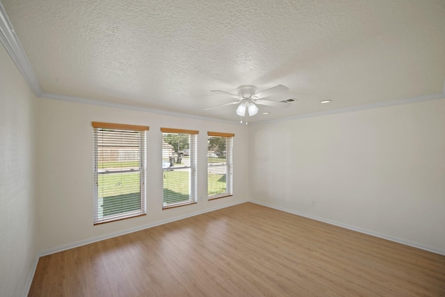 13510 Cedar Point Dr, Cypress, TX 77429 - spare room featuring ceiling fan, baseboards, ornamental molding, and light wood-style floors