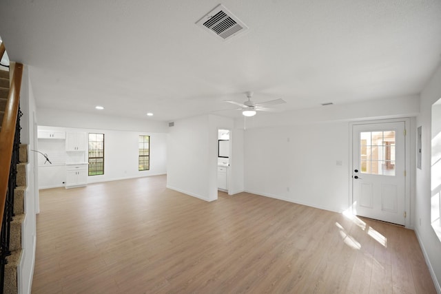 13510 Cedar Point Dr, Cypress, TX 77429 - unfurnished living room with light wood-type flooring, ceiling fan, baseboards, visible vents, and recessed lighting