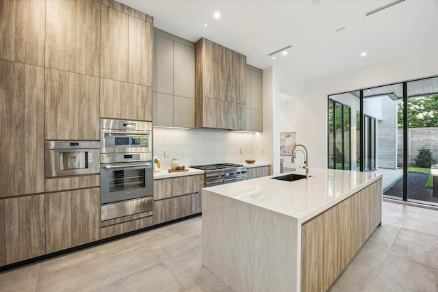 310 E Cowan Dr, Houston, TX 77007 - kitchen with modern cabinets, a warming drawer, light countertops, a sink, and stainless steel appliances