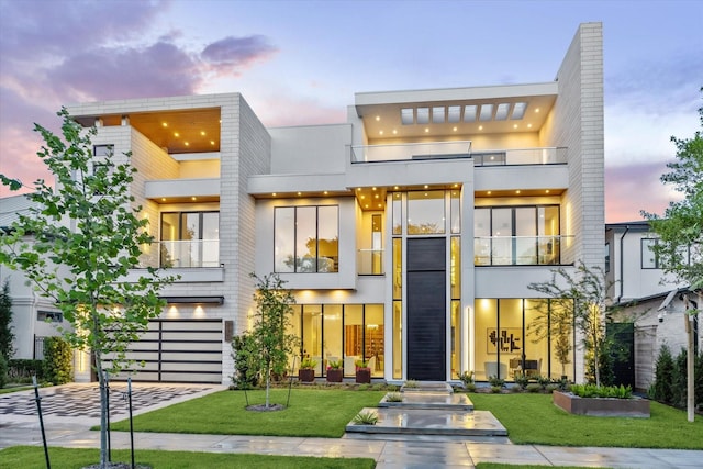 310 E Cowan Dr, Houston, TX 77007 - modern home featuring a garage, driveway, a chimney, and a front lawn