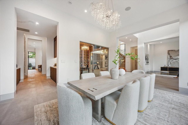 310 E Cowan Dr, Houston, TX 77007 - dining room featuring recessed lighting, baseboards, and an inviting chandelier