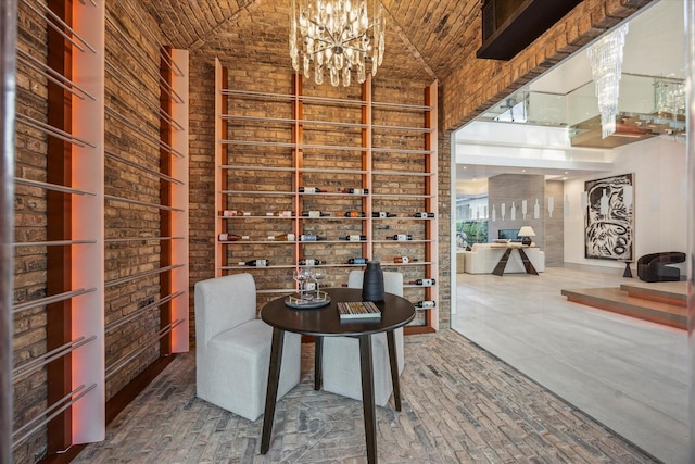 310 E Cowan Dr, Houston, TX 77007 - wine area featuring a chandelier, brick ceiling, and a high ceiling