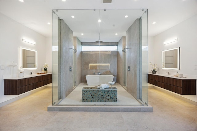 310 E Cowan Dr, Houston, TX 77007 - bathroom featuring a shower stall, vanity, and a freestanding bath