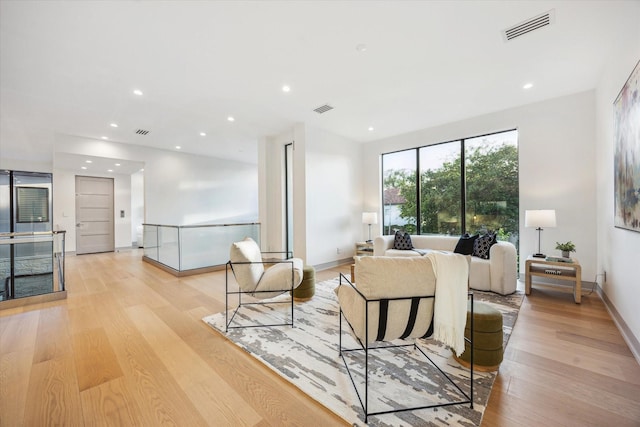 310 E Cowan Dr, Houston, TX 77007 - living room featuring light wood-style flooring, visible vents, and recessed lighting