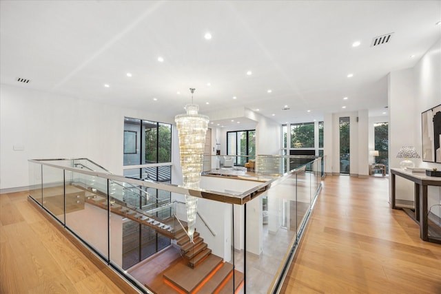 310 E Cowan Dr, Houston, TX 77007 - stairs featuring visible vents, recessed lighting, and wood finished floors